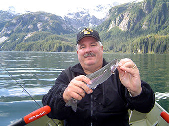 Island Wings client fishing at a forest service cabin.  A sea plane is the only way to access many cabins in southeast Alaska.
